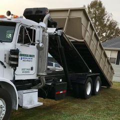 A dump truck with the word invisible on the side