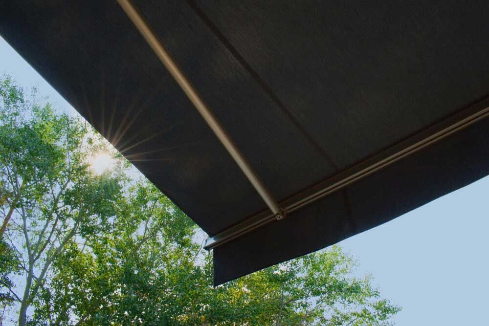 The Sun Is Shining Through The Trees Behind The Awning — Homemakers Lifestyle In Noosa, QLD
