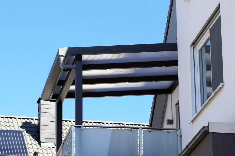 A Balcony With A Canopy And Solar Panels On The Roof — Homemakers Lifestyle In Noosa, QLD