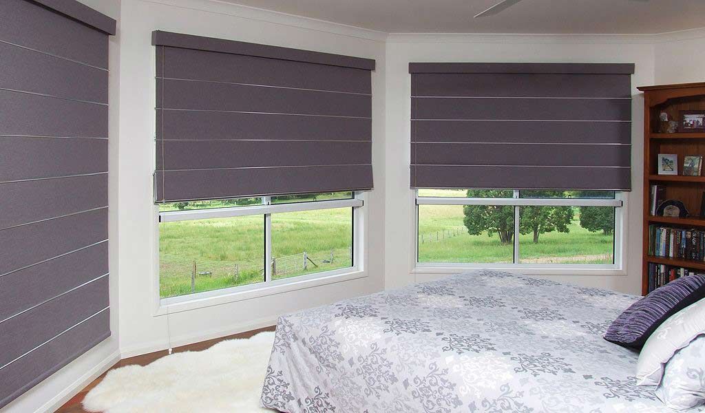 A Bedroom With A Bed And Purple Blinds On The Windows — Homemakers Lifestyle In Maroochydore, QLD