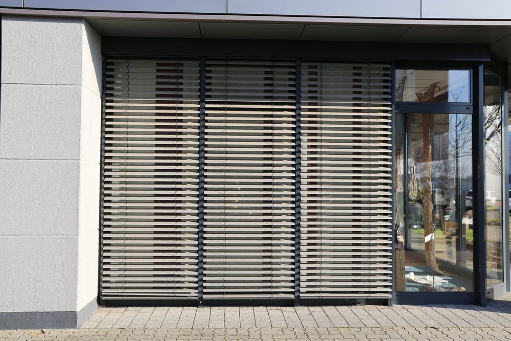 Home with Glass Outdoor Window blinds — Homemakers Lifestyle Maroochydore In Maroochydore QLD