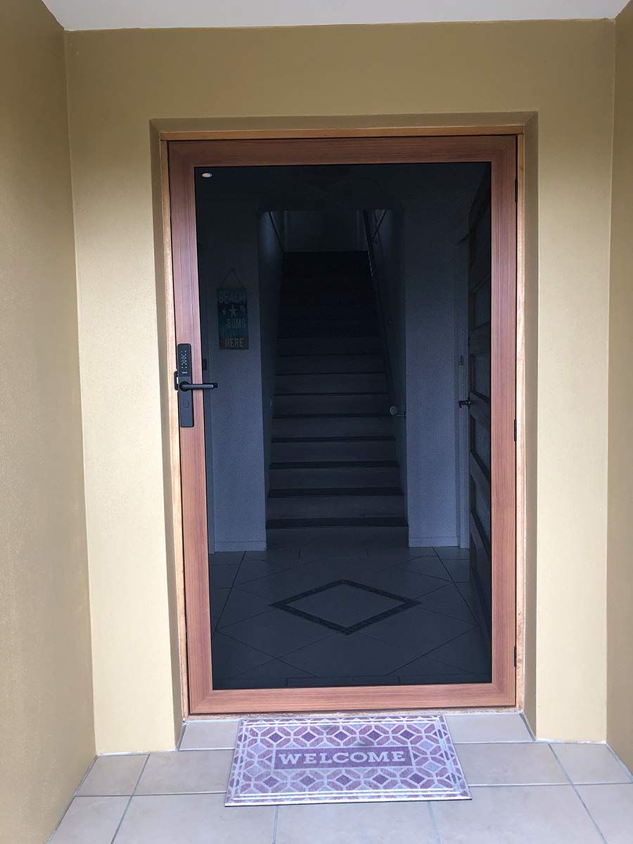 A Door With A Welcome Mat In Front Of It — Homemakers Lifestyle In Maroochydore, QLD