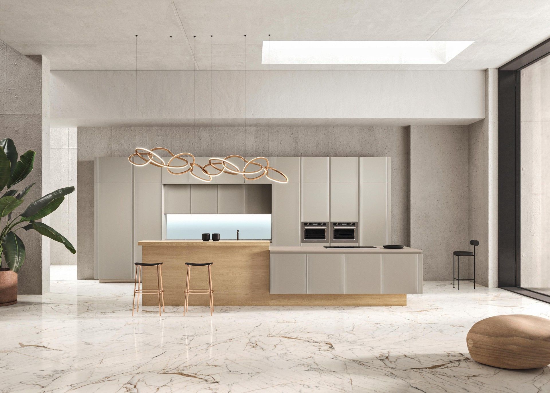 Una cucina con una grande isola al centro della stanza.