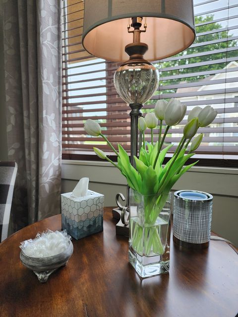 table with lamp and flowers