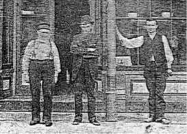 three undertakers standing in front of their storefront circa 1880's