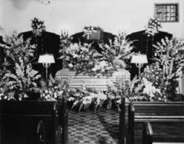 Photo of funeral chapel with casket from 1950's in black and white