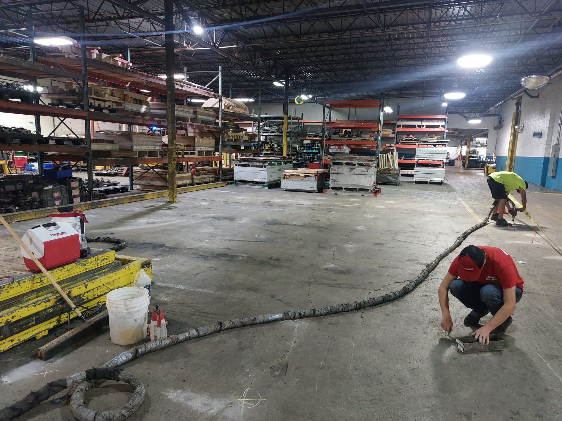 Concrete Lifting Technologies working hard to level the warehouse floor of a client in Portage, WI