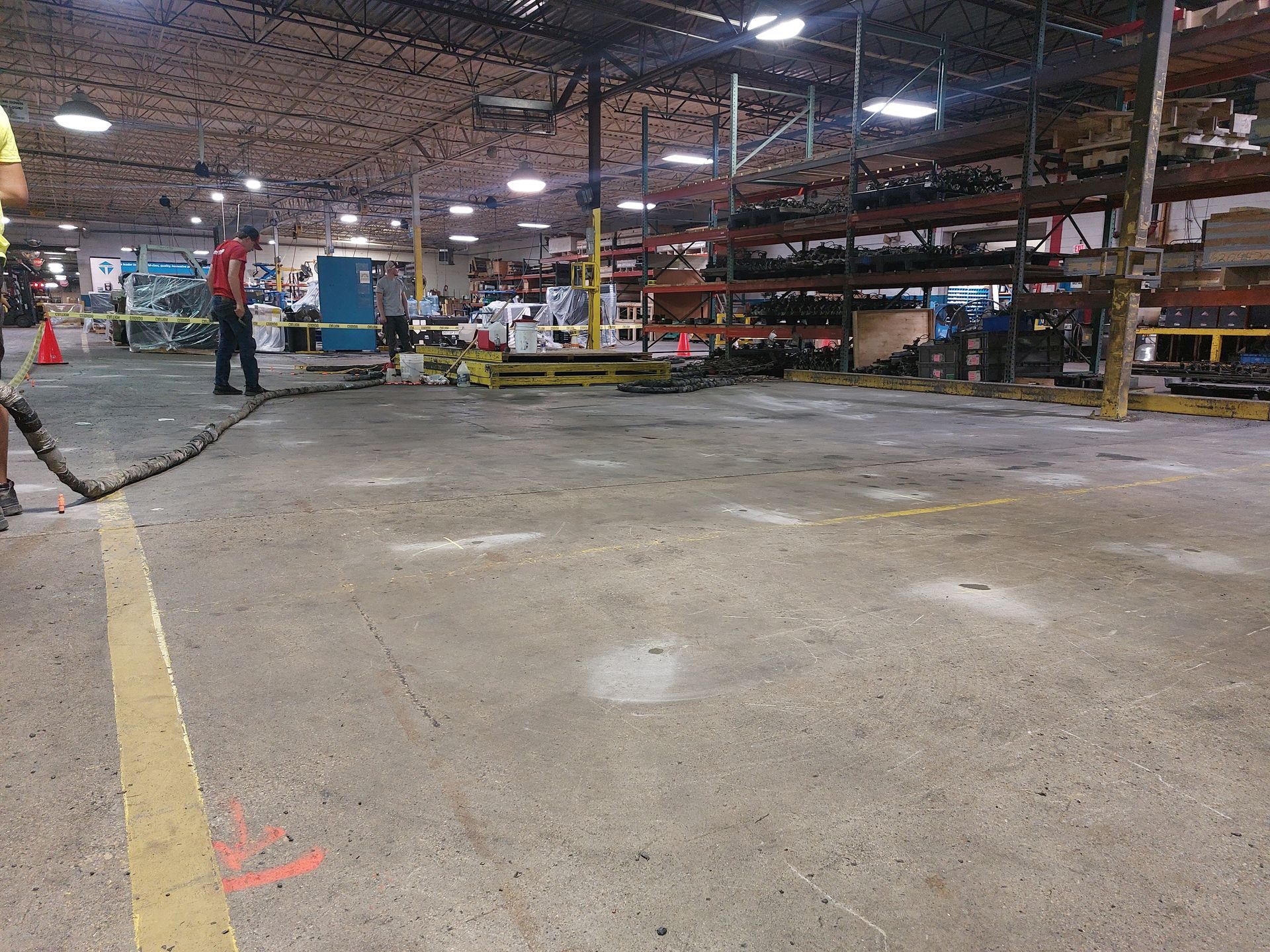 Concrete Lifting Technologies working hard to level the warehouse floor of a client in Portage, WI