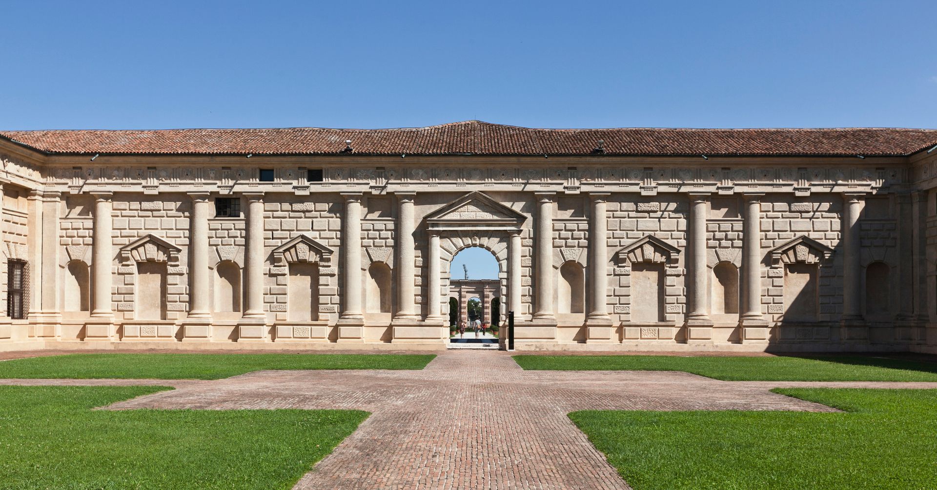 A large building accessed by a brick walkway.