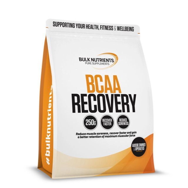 Orange and white BCAA Recovery supplement pouch with bold black text and circular claim badges