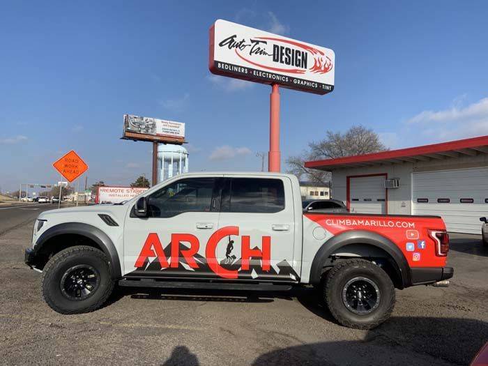 White Ford Raptor truck with 