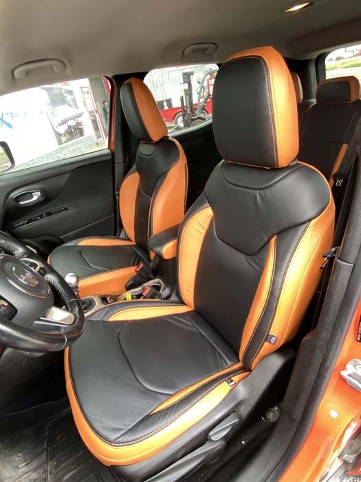 Black and orange leather car seats in a Jeep Renegade.