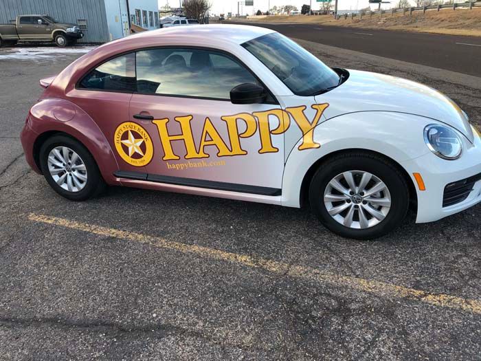 White and burgundy VW Beetle with 