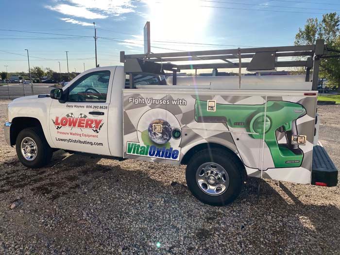 White work truck with logos for 