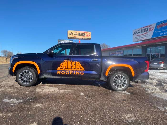 Dark blue truck with orange accents and 