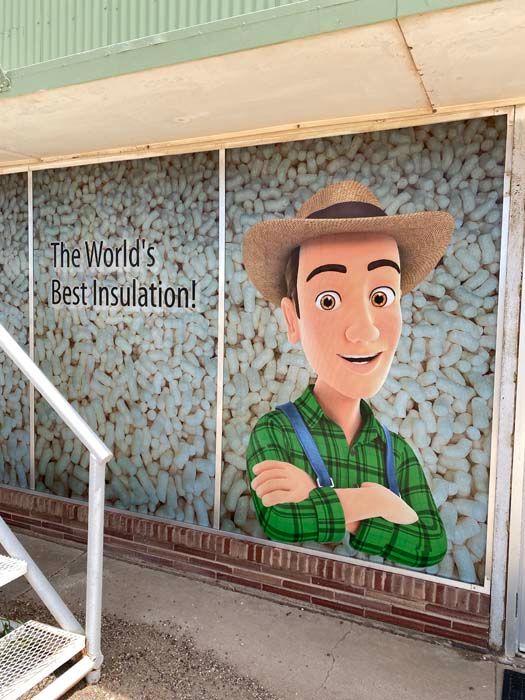 Cartoon farmer on a wall with text 
