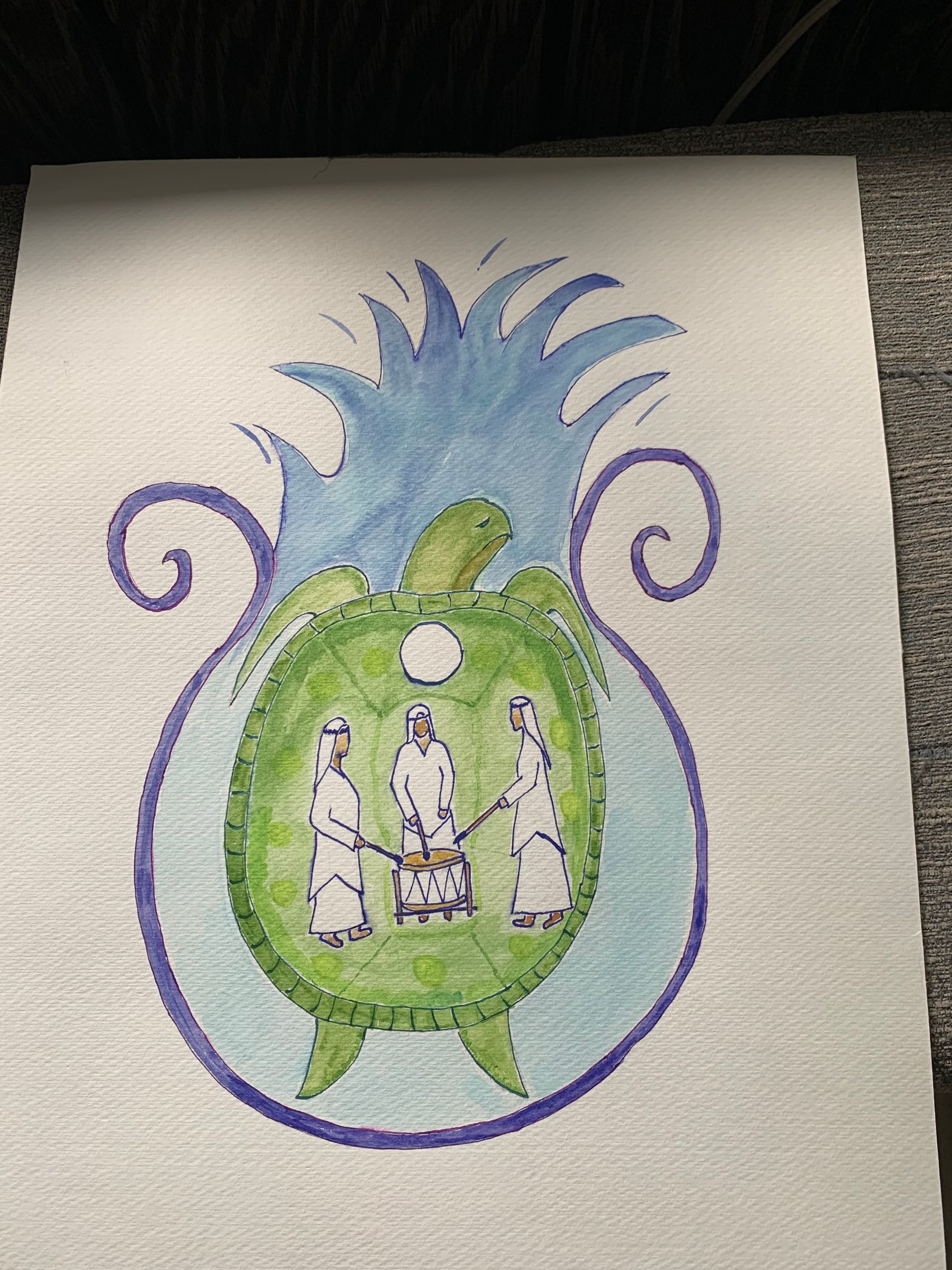 Colorful hand-drawn floral emblem in green and blue with three small figures inside