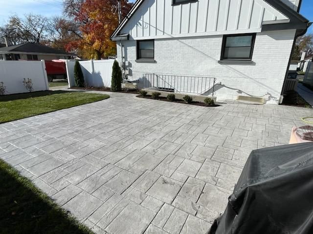 A white house with a patio in front of it