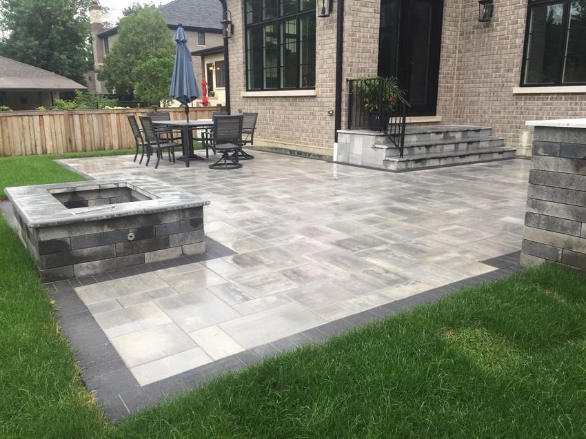 There is a fire pit in the middle of the patio.