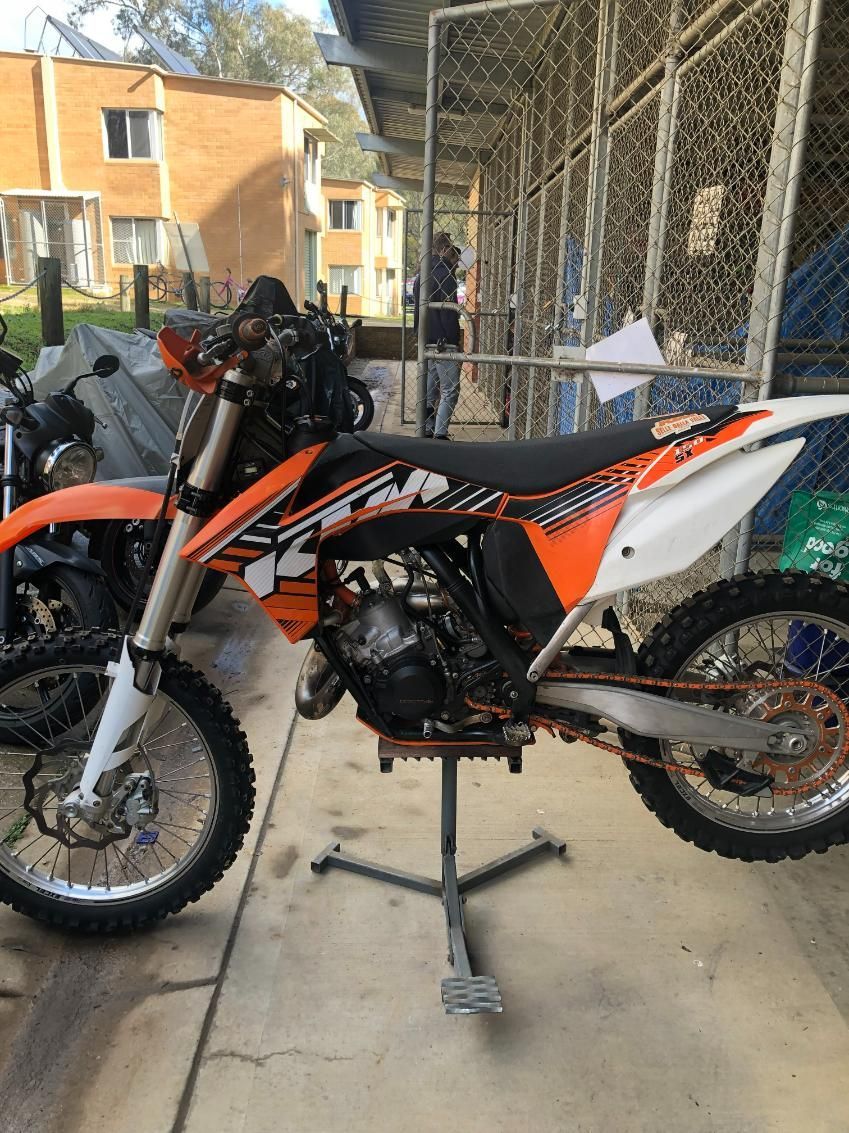 Orange and Black KTM Dirt Bike on a Stand, Outdoors, Near a Building — Bodes All Mechanical In Candelo, NSW