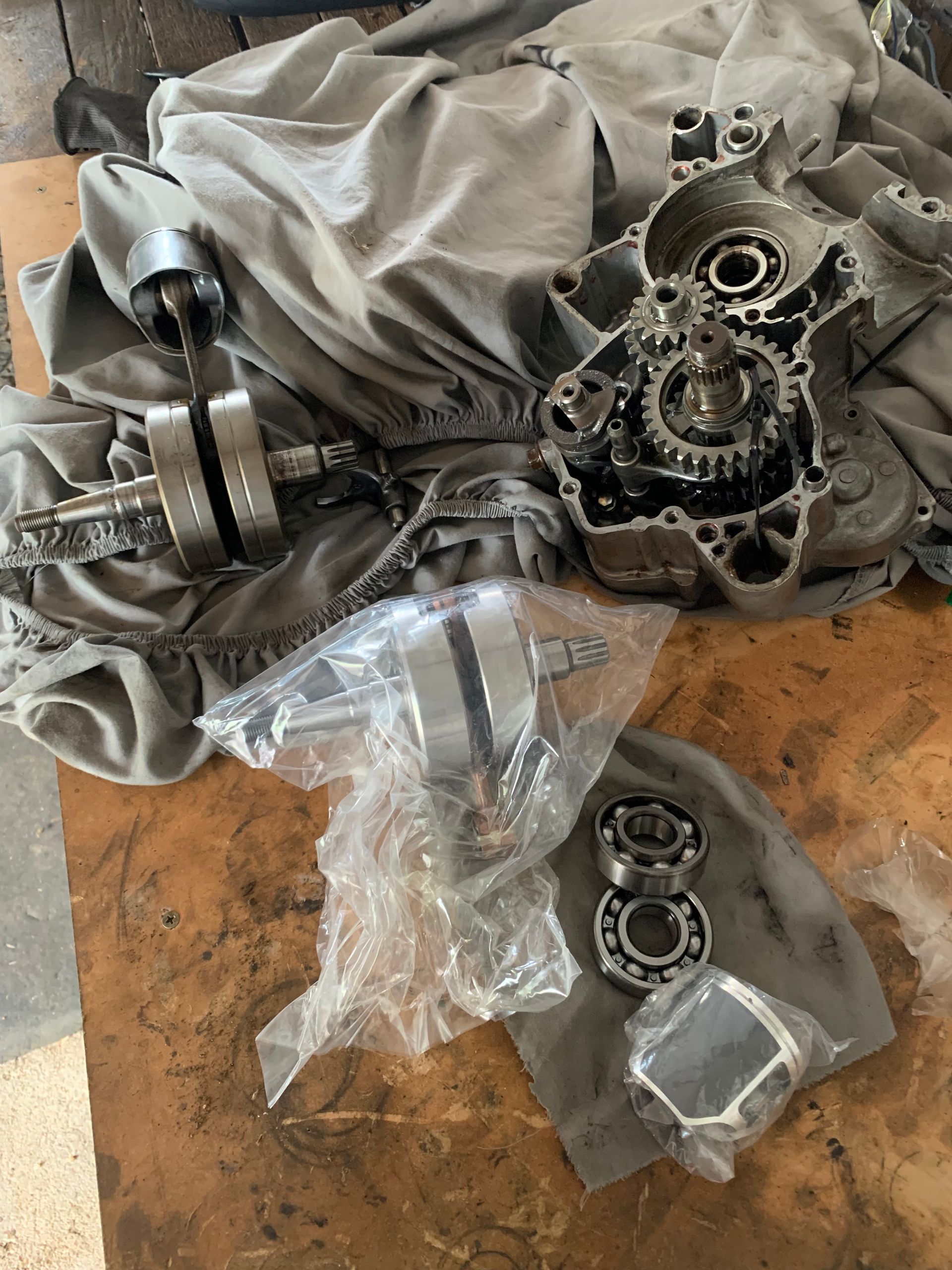 Motorcycle Engine Parts Disassembled on a Surface, Including Crank, Gears, and Bearings — Bodes All Mechanical In Bega, NSW