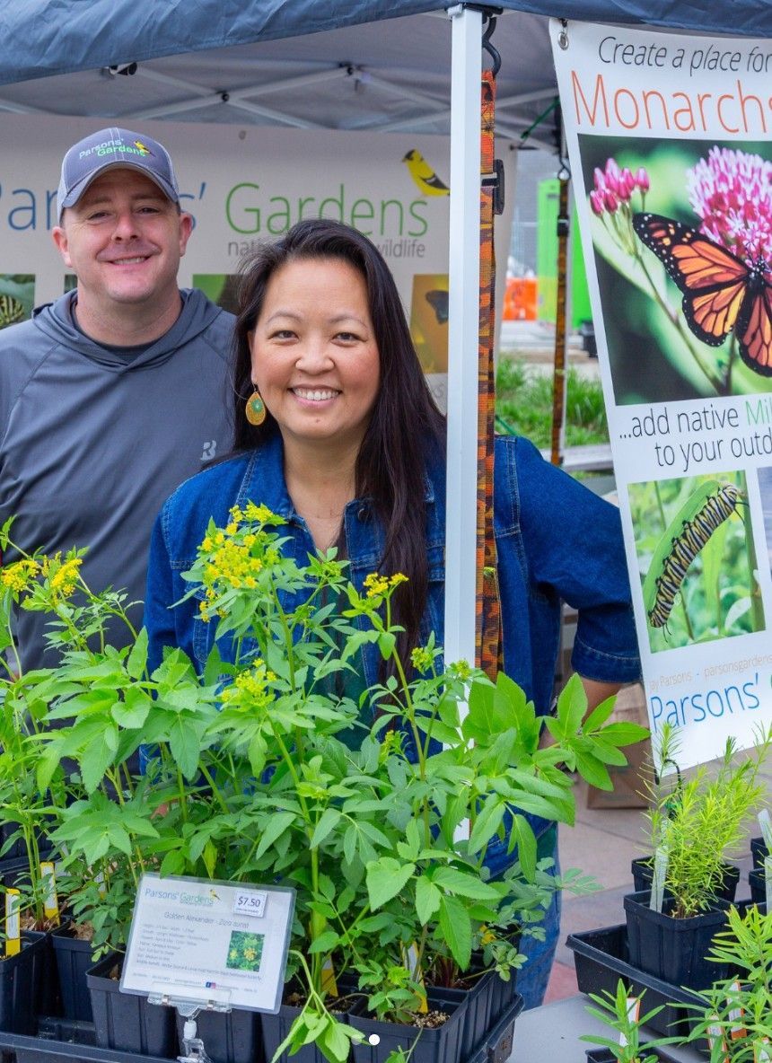 A photo of a couple selling plants