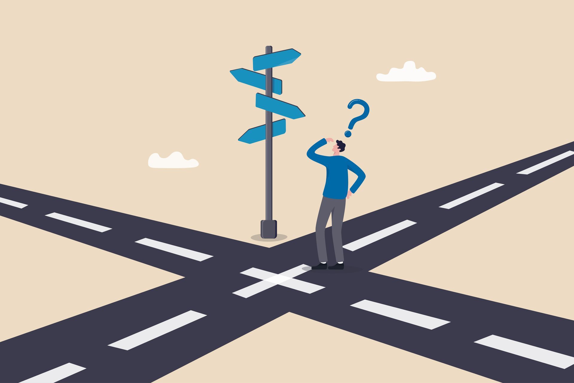 A man is standing at a crossroad looking at a sign.
