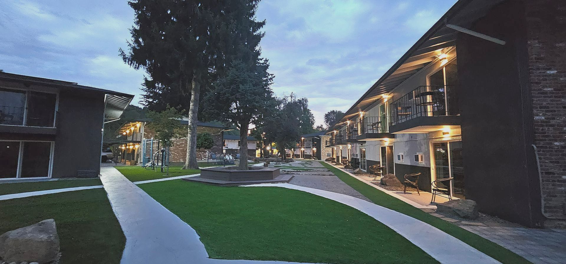 A row of apartment buildings with a walkway between them
