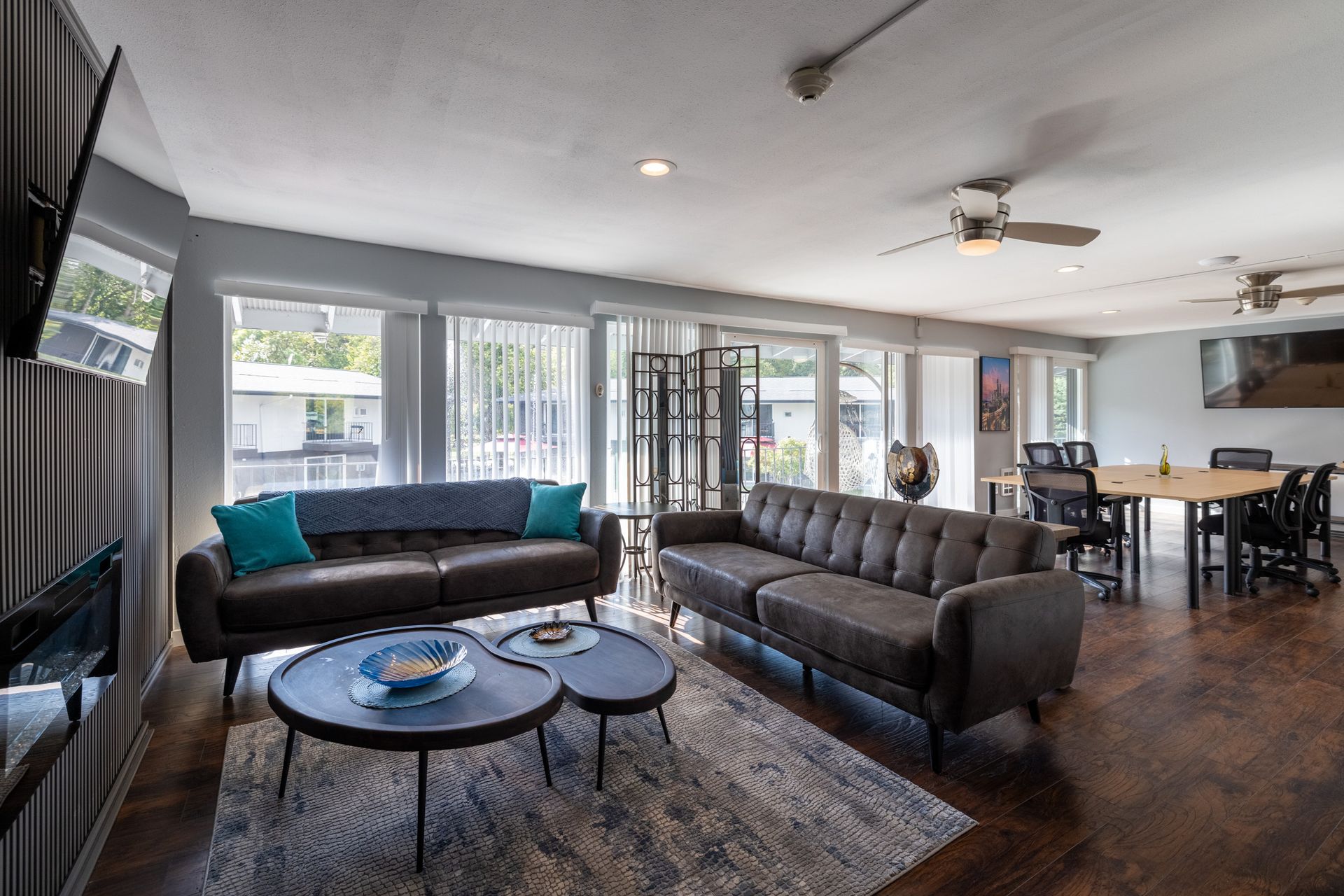 A living room with a couch and two coffee tables