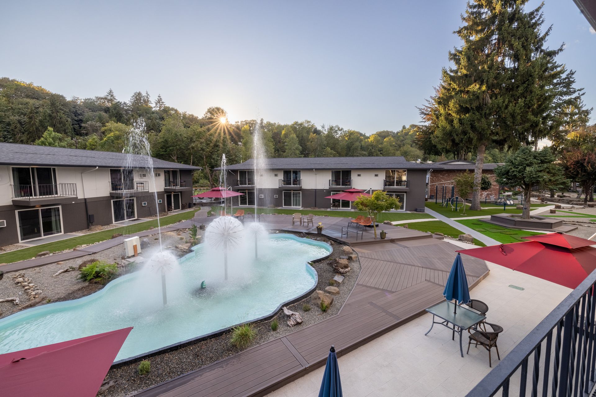 There is a fountain in the middle of the courtyard of a building.