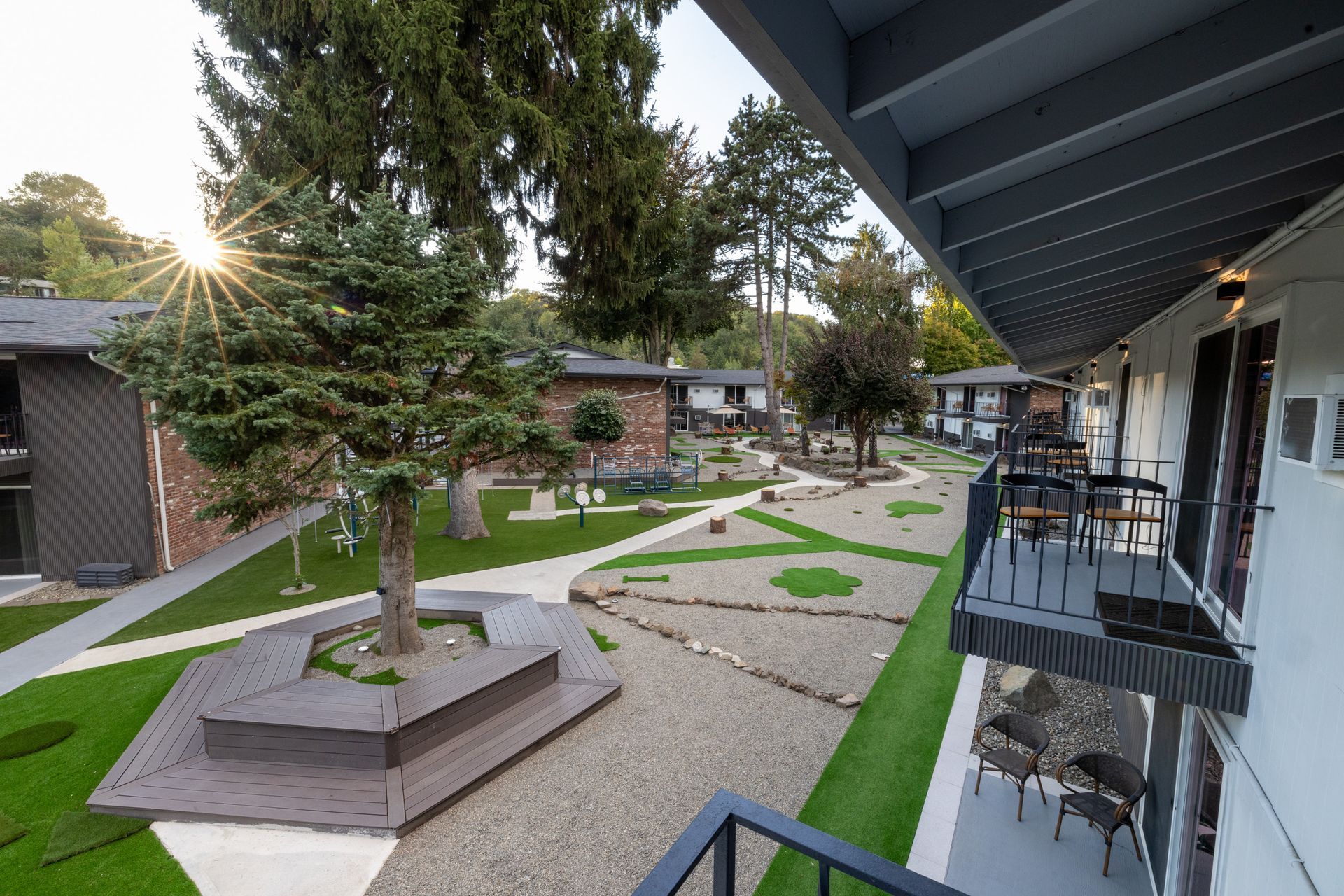 A view of a residential area from the balcony of a building.