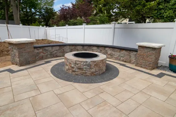 Backyard fire feature installation enhancing patios and outdoor spaces