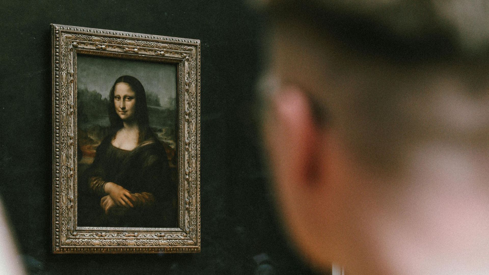 Mona Lisa at The Louvre Museum in front of tourist during a guided tour