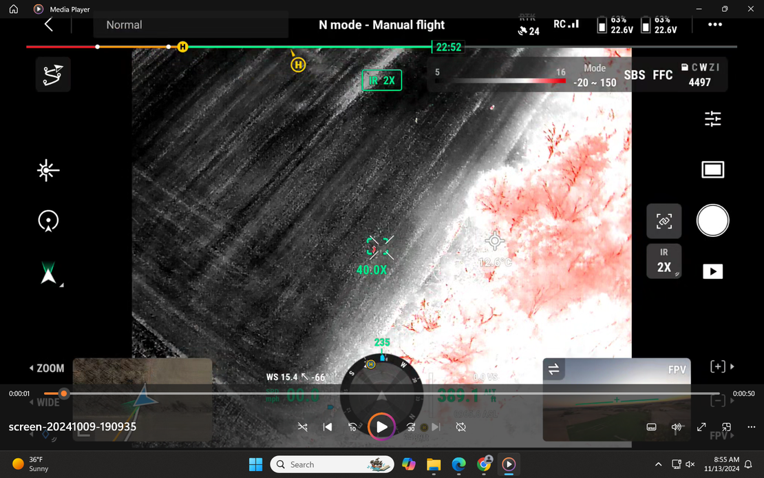 Thermal image of a deer in a an ag field