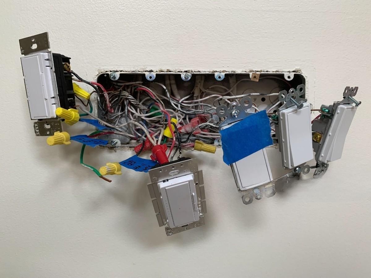a bunch of wires are taped to a wall