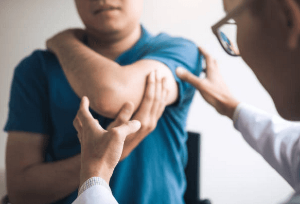 Work related injury being inspected by a doctor.