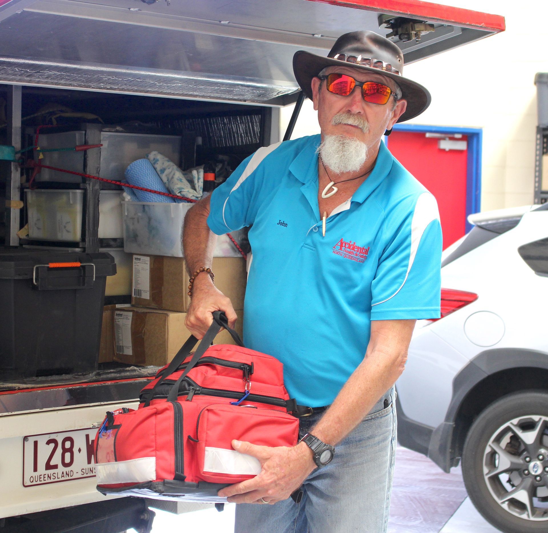 Man Delivering First Aid Kit  —  Accidental Health & Safety NQ & Mt Isa In Longreach, QLD