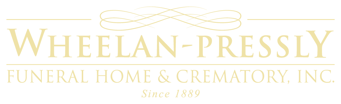 Logo for WHEELAN-PRESSLY Funeral Home & Crematory, Inc., in light gold font, with an intertwined symbol above the text.