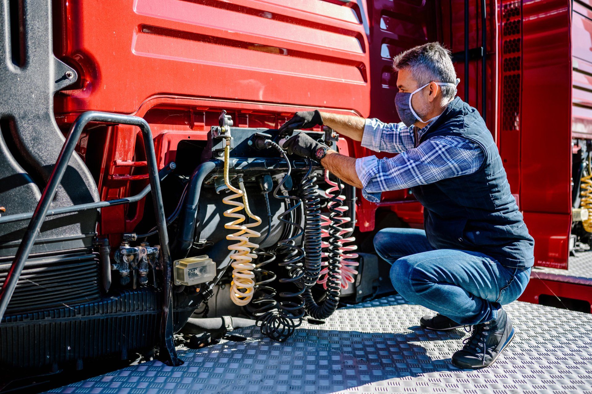 Man Checking Wires - Hagerstown, MD - Hagerstown Spring & Alignment Inc