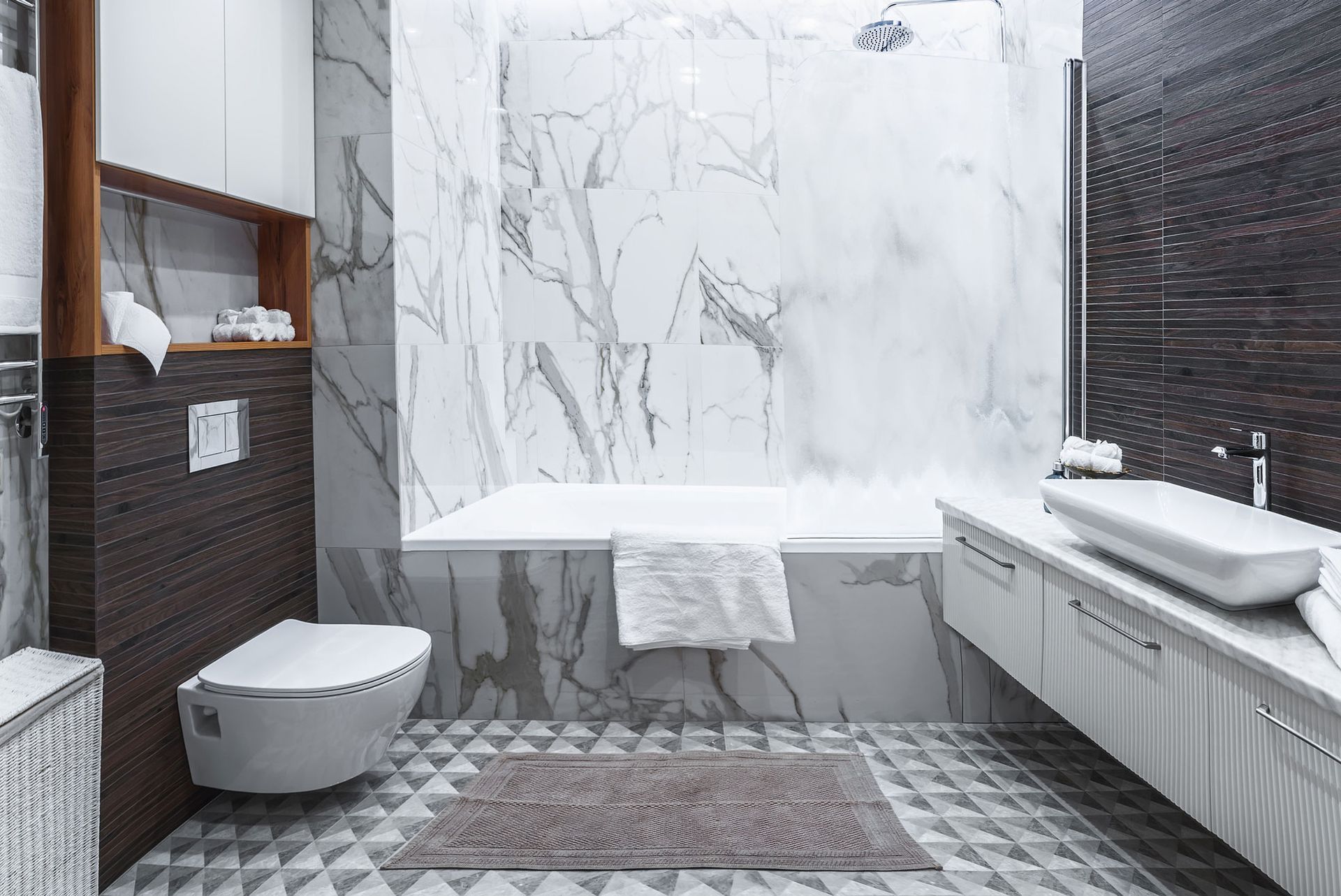 A bathroom with a bathtub, toilet, sink and shower. A bathroom with a bathtub, toilet, sink and shower.