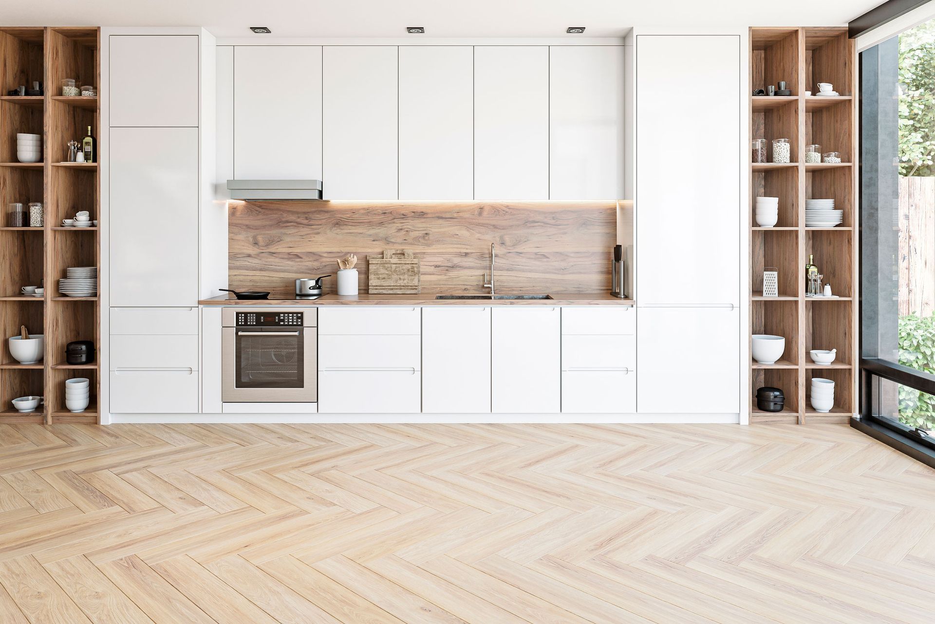 A modern kitchen with white cabinets and wooden floors. A modern kitchen with white cabinets and wooden floors.