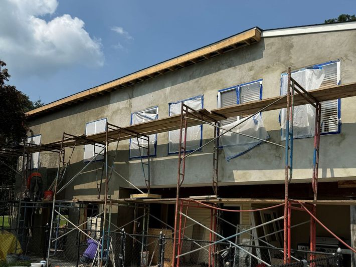 A building is being built with scaffolding around it.
