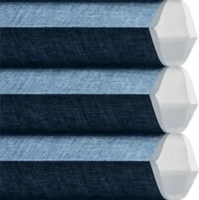 Three stacked blue denim rolls with white hexagonal ends