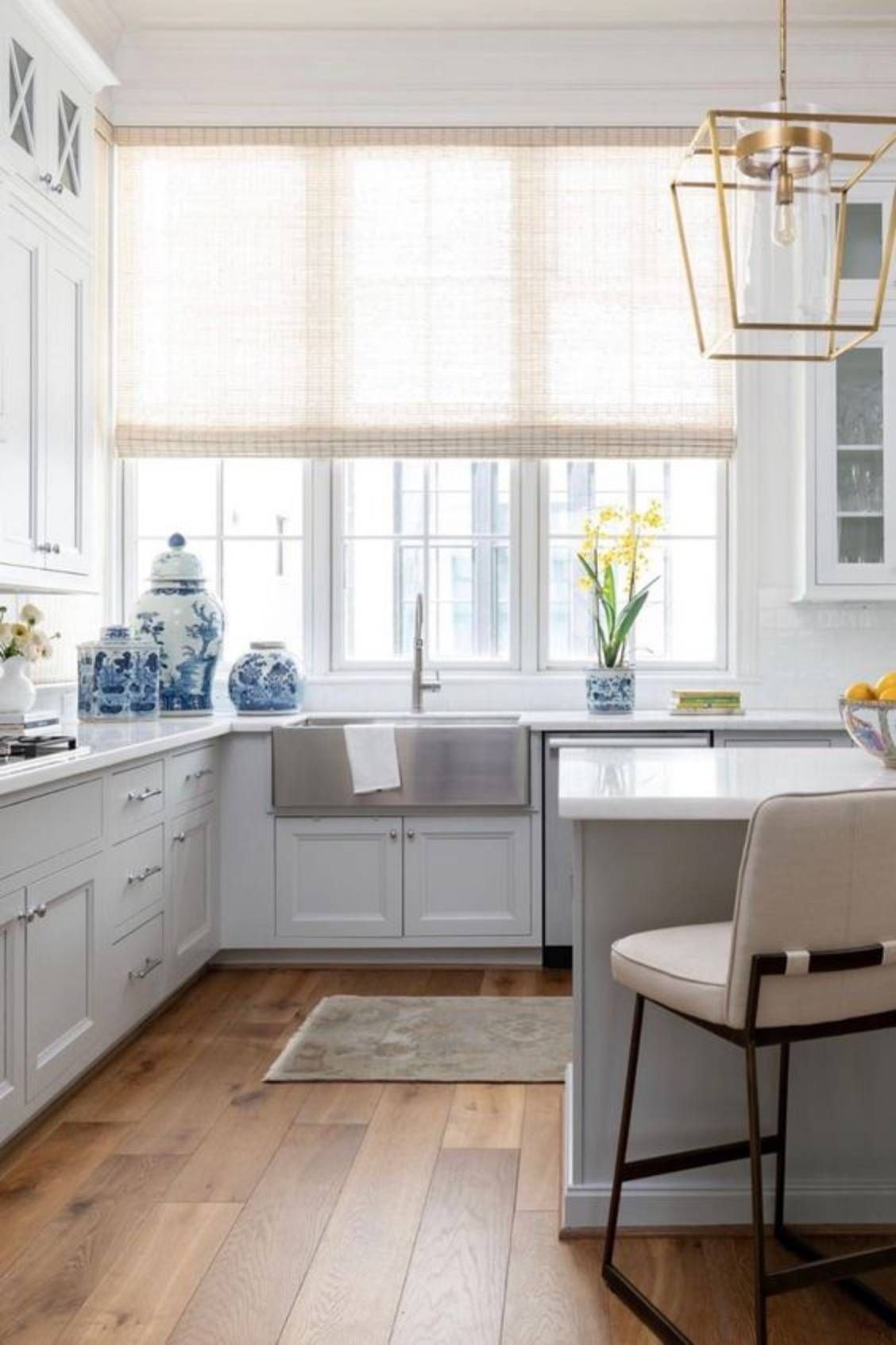 Hunter Douglas Provenance® Woven Wood Shades bring natural texture to bright kitchen windows.