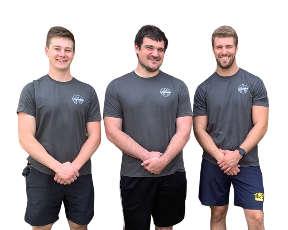 Three people in matching grey t-shirts stand side-by-side against a white background, smiling with hands clasped.