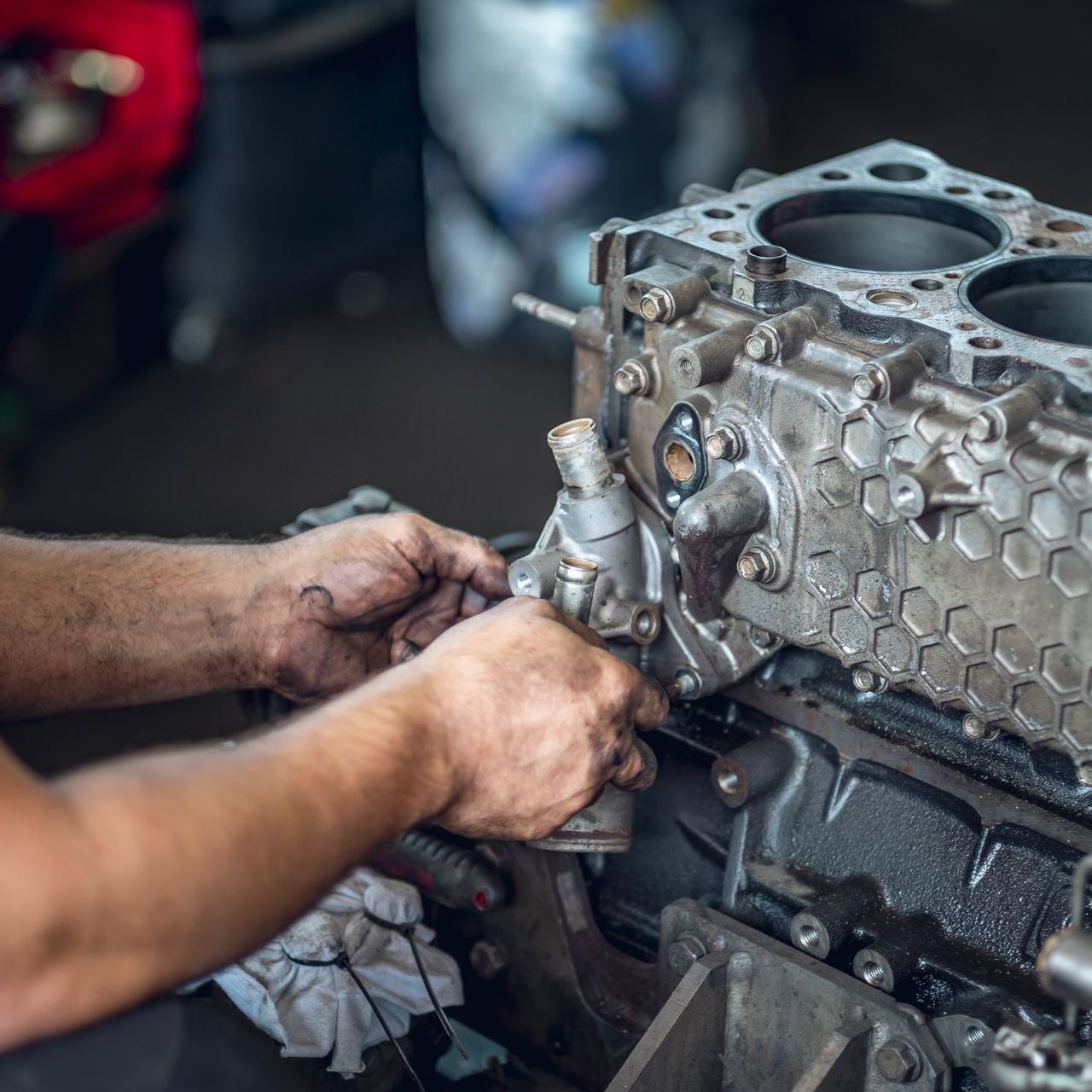 A mechanic fixing a machine