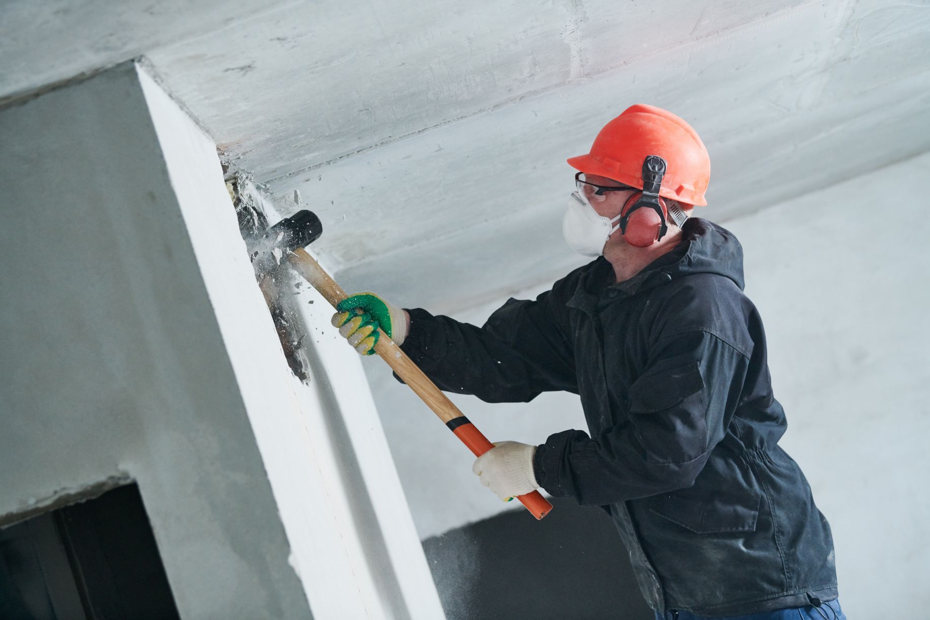 Worker with Sledgehammer — Demolition Contractors in Lismore, NSW Worker with Sledgehammer — Walsh Demolition Pty Ltd in Lismore, NSW