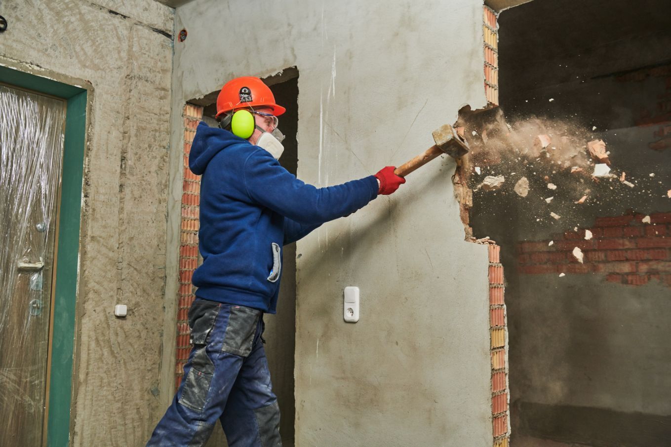 Worker Destroying the Wall — Walsh Demolition Pty Ltd in Lismore, NSW