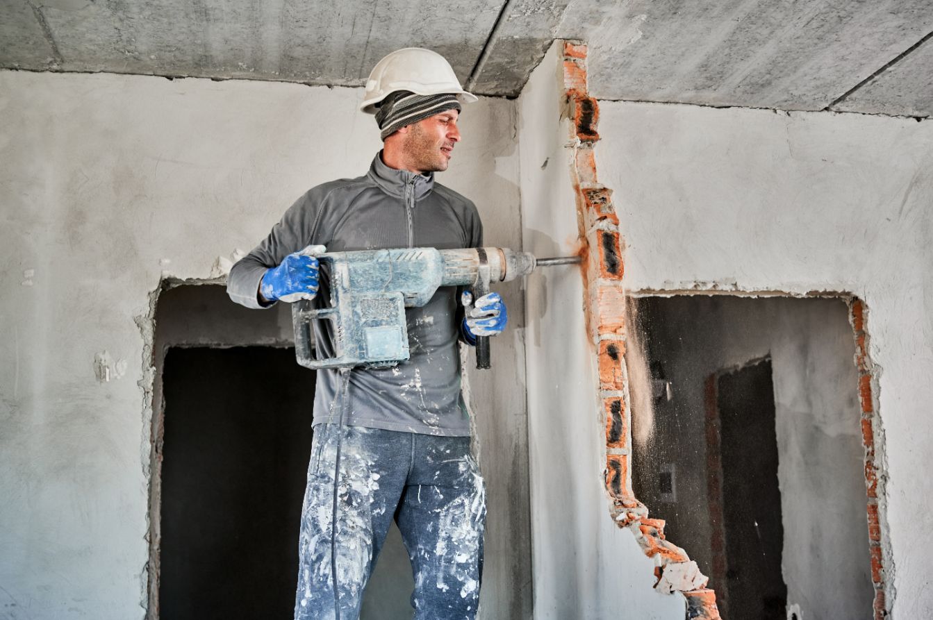 Worker with Drill Breaker — Walsh Demolition Pty Ltd in Casino, NSW