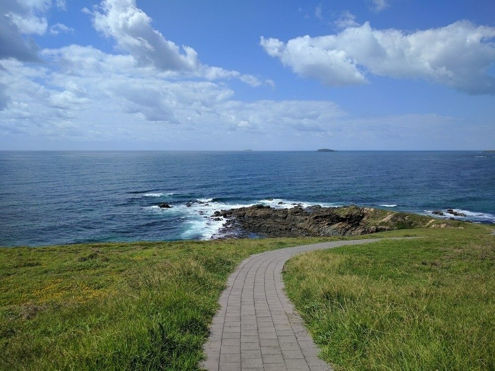 A Paved Path Winds Toward the Ocean — Walsh Demolition Pty Ltd in Woolgoolga, NSW